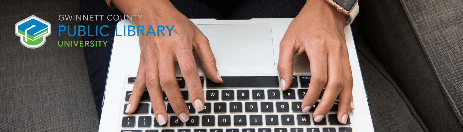 Typing on laptop at Gwinnett Library University.