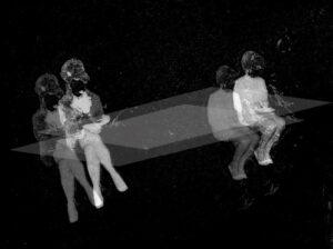 Abstract art of two seated figures in sequence