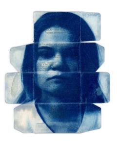 Blue photographic collage of a woman's face.