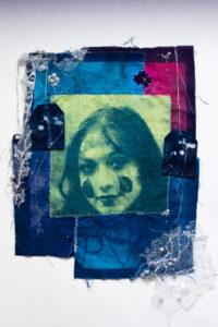 Artistic fabric collage with a portrait and lace.