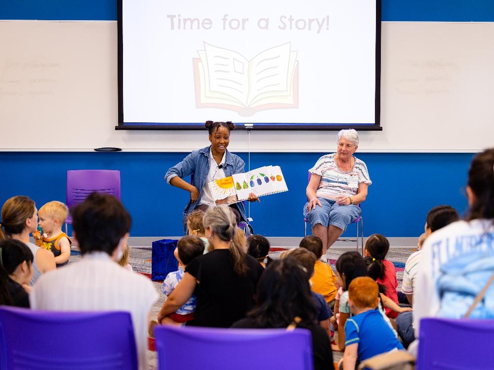 Storytime session with children and storytellers.