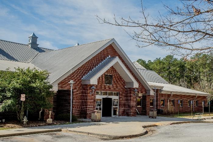 centerville branch exterior Brick building with metal roof and trees nearby.