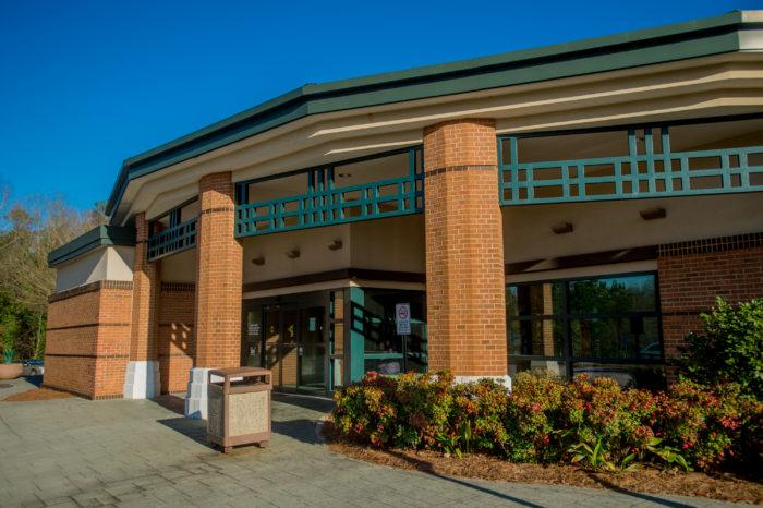 five forks branch exterior Modern library entrance with brick columns.