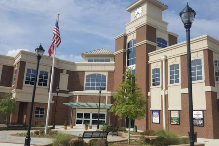 lilburn branch exterior Clock tower building with American flag.