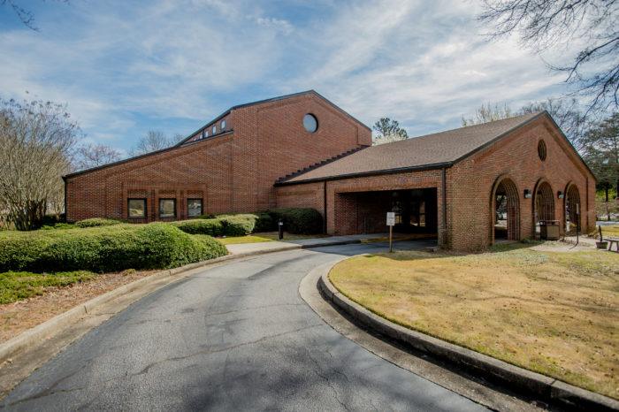 mountain park branch exterior Brick community center with circular driveway entrance.