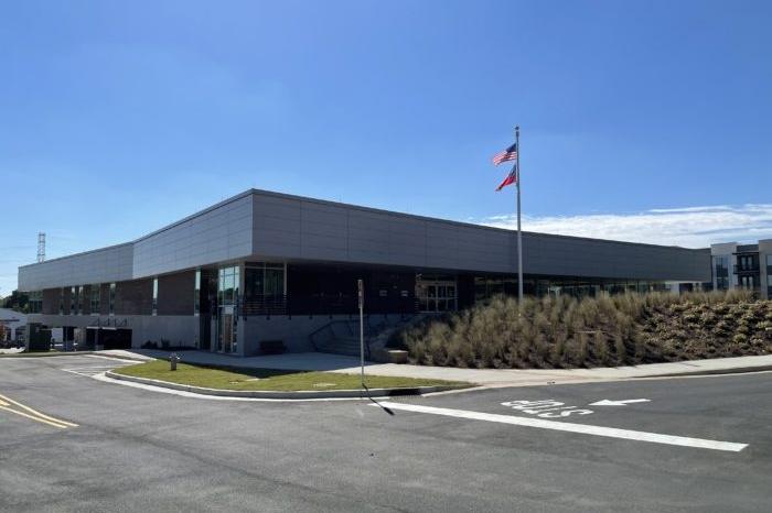 norcross branch exterior Modern building with American and state flags outside.