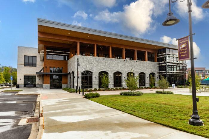 snellville branch exterior Modern building with stone facade and green lawn.