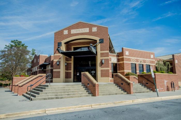 suwanee branch exterior Brick public library building entrance with steps.