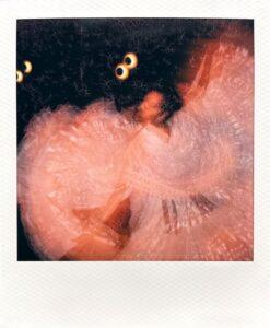 Abstract motion blur of dancer in flowing dress.