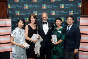 Alton Brown poses with guests at library foundation event.
